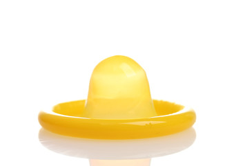 Yellow condom isolated on white