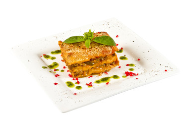 Closeup of lasagna and basil fork