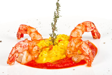 Plate of Shrimps Risotto garnished with fresh parsley and Parmes