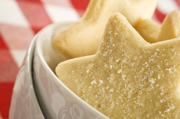 Sugar coated shortbread cookies in star shapes stacked up