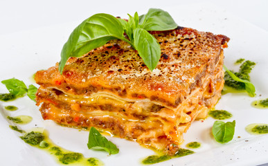 Closeup of lasagna and basil fork