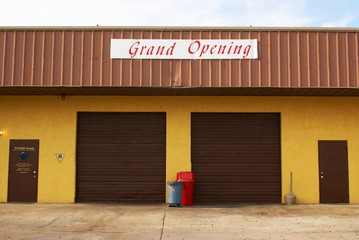 Industrial unit in Cocoa, Florida, with "Grand Opening" sign
