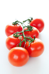 Branch of ripe cherry tomatoes close up