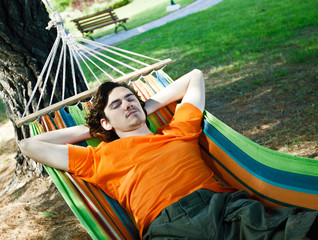 The young man has a rest in a hammock