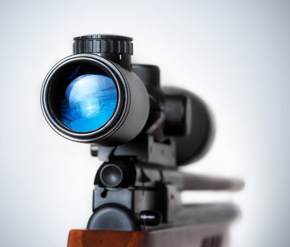 Closeup of a sniper rifle telescope glass lens isolated