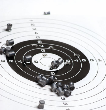 paper rifle target with bullet holes