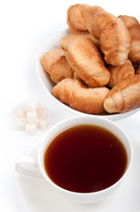 croissant with tea and sugar