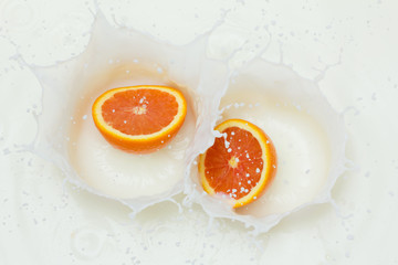 Orange and splashing milk