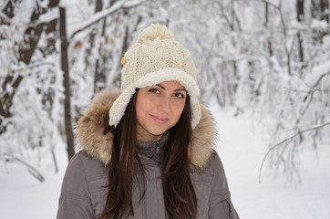 Portrait on beautiful girl in the winter forest