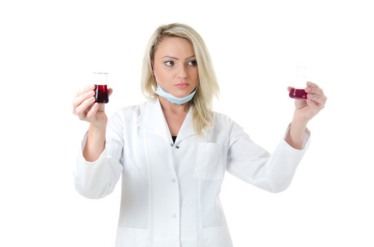 Beauty lab worker holding and comparising