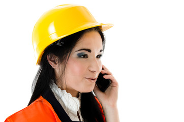 Young woman in yellow helmet talking on the phone