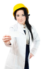 Woman in white coat holding blank business card