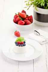 Panna cotta with Berries on white table