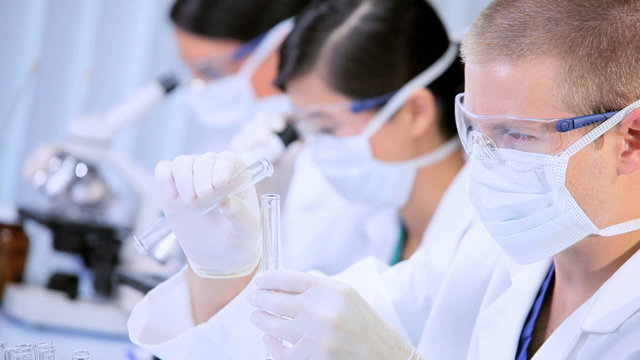 Three Student Doctors Studying in Hospital Laboratory