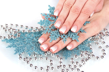 beautiful hands and snowflakes and beads isolated on white