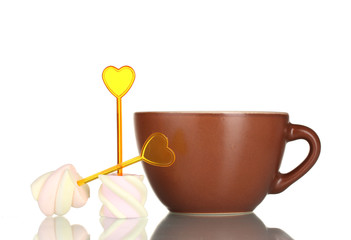 Two marshmallows with skewers and cup isolated on white