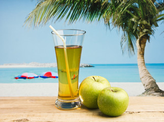Apple juice in a glass on a table