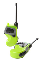 Two green walki talkies on a white background.