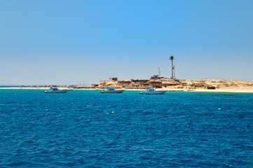 Sandy island on the horizon