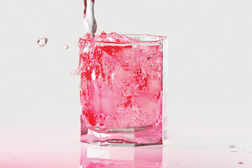 Glass of water, ice and red cranberries with splash