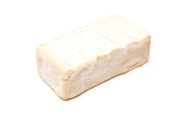 French Demi Pont L'Eveque cheese isolated on a white studio back