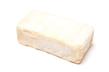 French Demi Pont L'Eveque cheese isolated on a white studio back