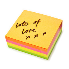 Post-it note isolated on a white studio background.