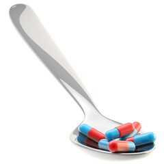 Metall spoon with a portion of medicine isolated