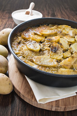 Tiella of potatoes, rice and mussels.