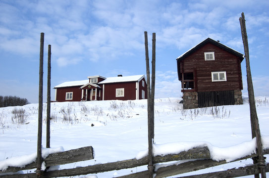 Scenic view of wooden houses in winter