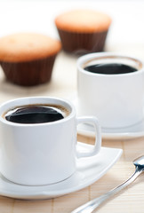 Aromatic hot coffee with muffins