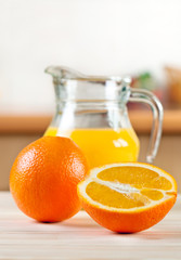 Oranges with a jug of juice
