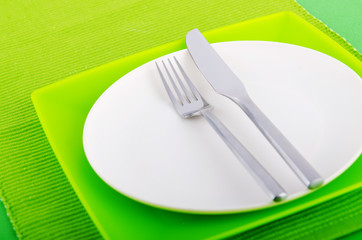 Empty plate with utensils