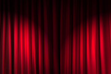 Brightly lit curtains in theatre concept