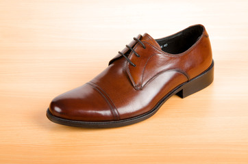 Brown shoes on wooden table