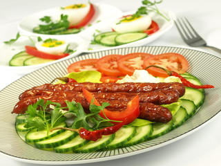 Juicy roasted sausages with crispy vegetables