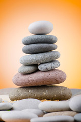 Balanced pebbles with colour background
