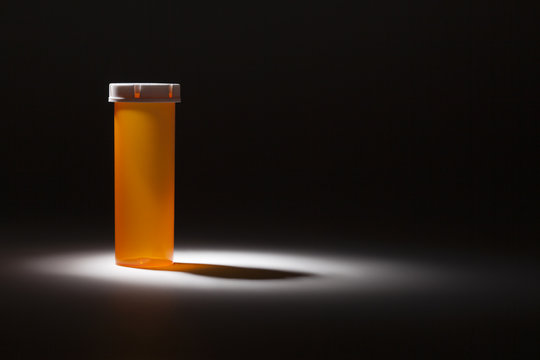 Empty Medicine Bottle Under Spot Light