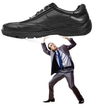 Woman domination concept with shoes and man