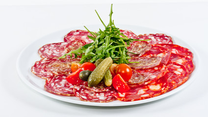 Italian sausage assorted with tomato, cucumber and ruccola