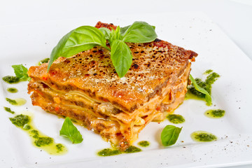 Closeup of lasagna and basil fork