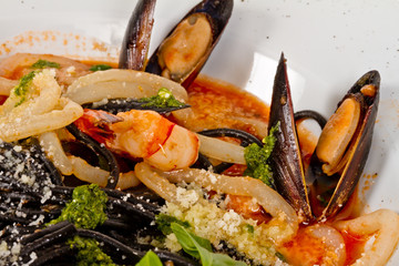 Black tagliatelle (pasta made with cuttlefish ink) with shrumps,