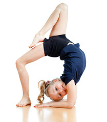 young girl doing gymnastics over white background