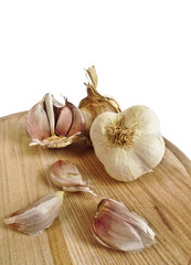garlic on a chopping board and white background