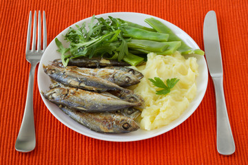 fried sardines with mashed potato and green beans