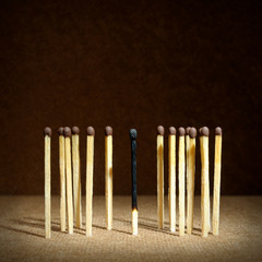 One burnt match among others