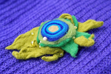 Felt of natural wool brooch