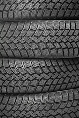 Background of four car wheel winter tires