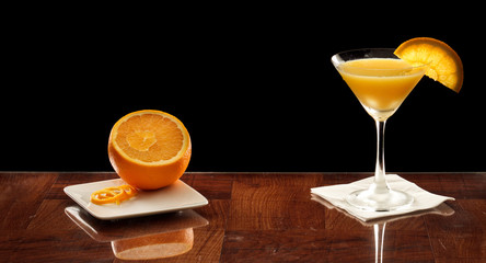 Orange martini with an orange slice