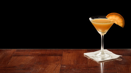 Orange martini with an orange slice
